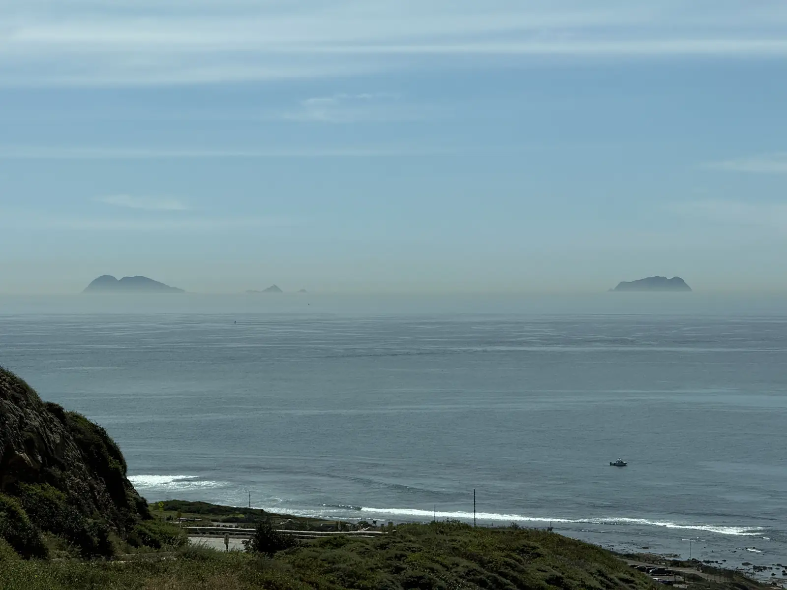 Hazy sea horizon with distant islands